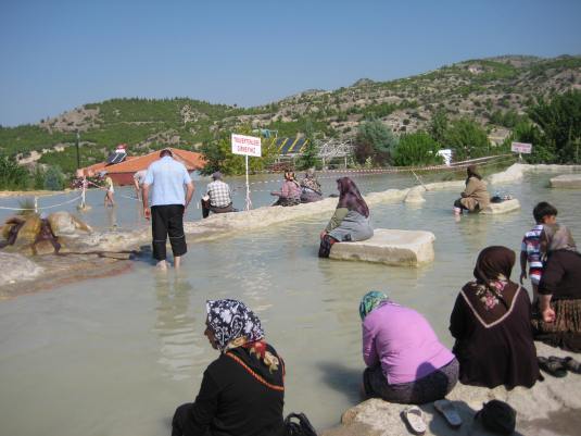 muslims bathing in the healing red waters